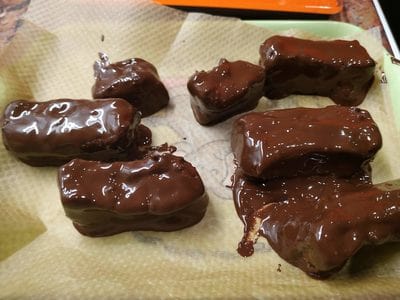 Place a baking paper on a tray or plate and add the chocolate patties Homemade Bounty Bars