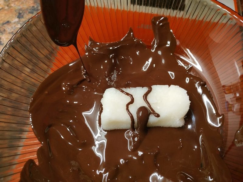 soak each coconut square into the melted chocolate Homemade Bounty Bars